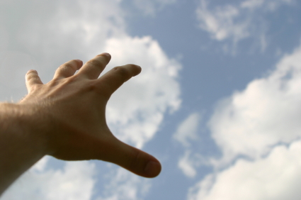 A hand reaching for the sky